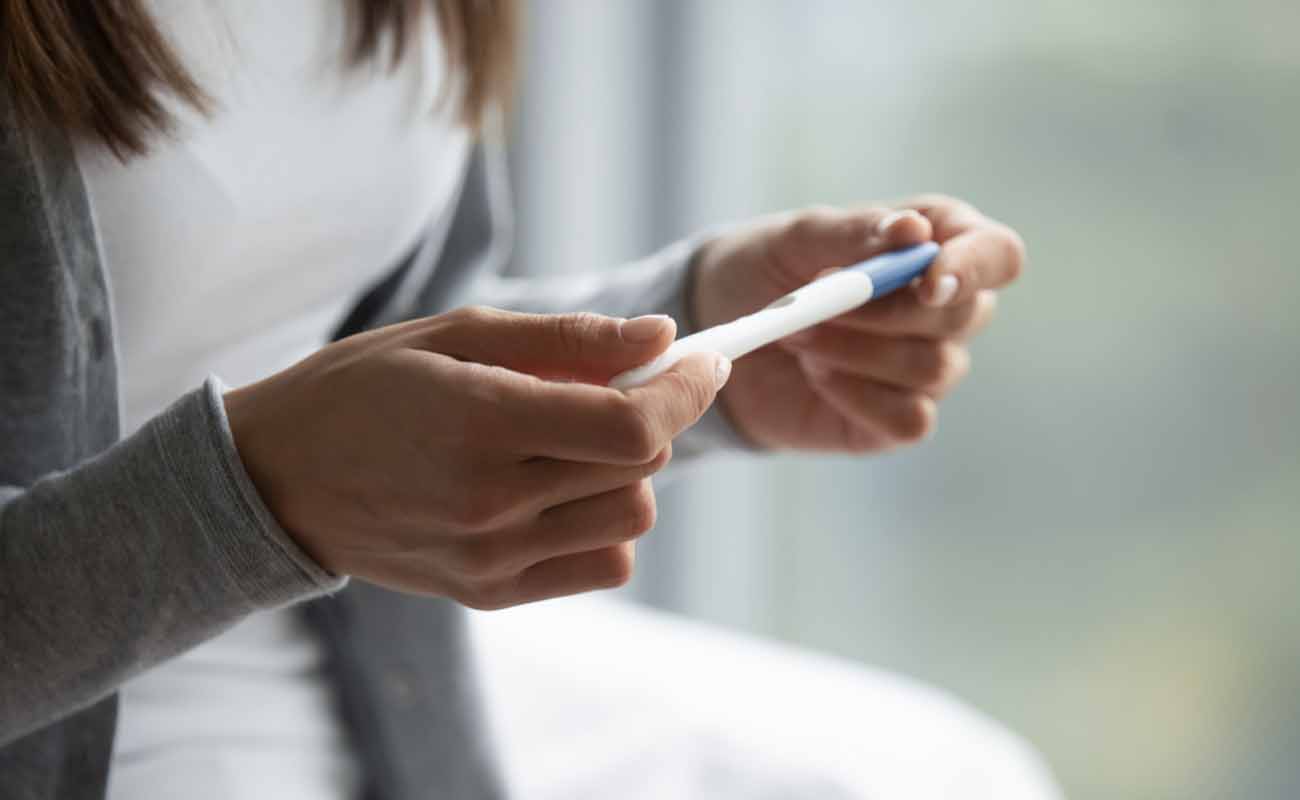 Woman Checking Pregnancy Test