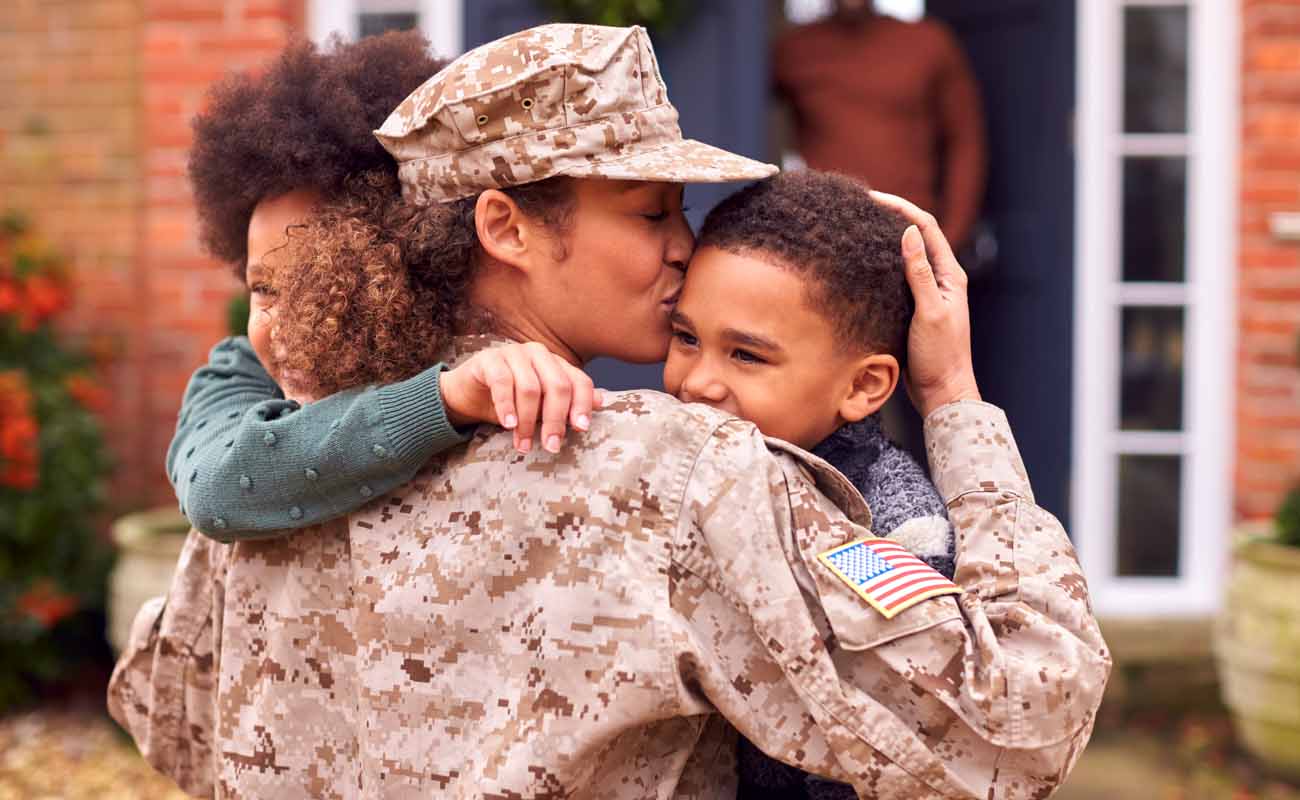 Military Women Hugging Her Children