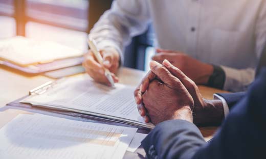 Two Individuals Working on Financial Planning